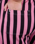 Close up of Juliet's hand in the back pocket of Longline Work Shorts in Bubblegum Pink