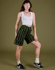 Angled front view of and Longline Work Shorts in Evergreen vintage tee white Cropped Tank on Alex