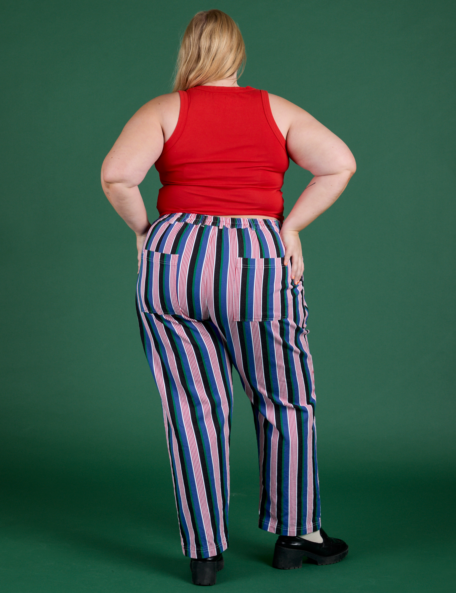 Back view of Work Pants in Pacific Stripe and mustang red Cropped Tank