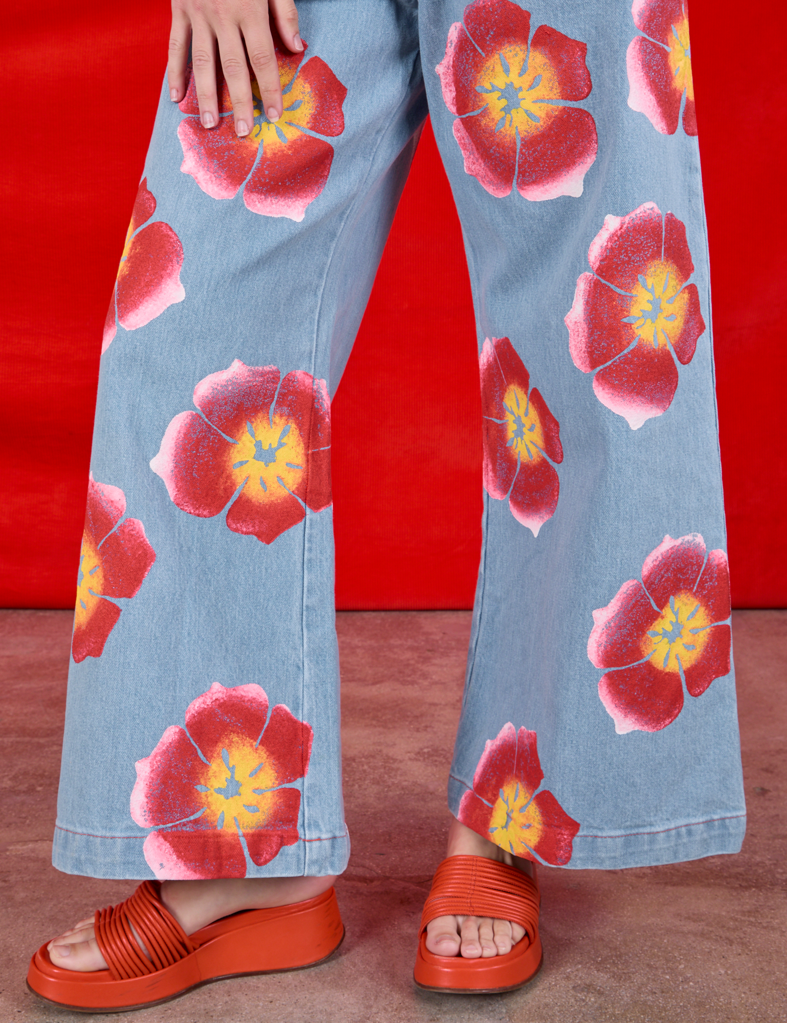 Wide Leg Denim Trousers in Painted Flowers pant leg close up on Alex