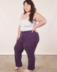 Angled view of Cropped Rolled Cuff Sweatpants in Nebula Purple and vintage off-white Cami on Ashley