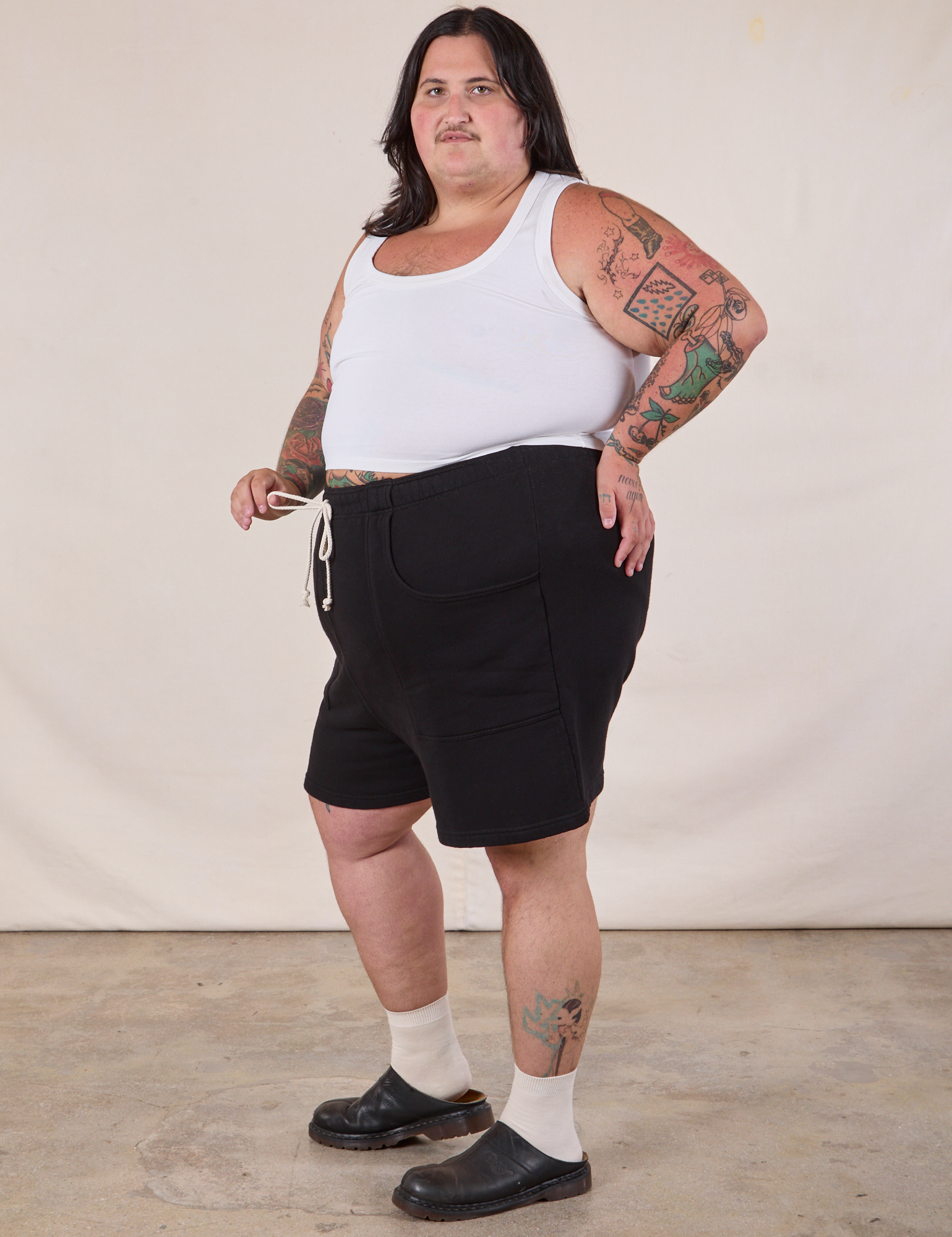 Side view of Heavyweight Sweat Shorts in Basic Black and Cropped Tank in Vintage Tee Off-White