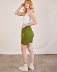 Side view of Lightweight Sweat Shorts in Summer Olive and Cropped Tank in vintage tee off-white on Margaret