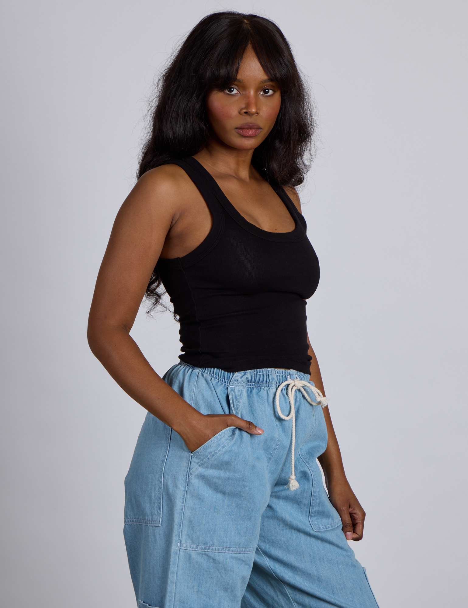 Side view of The Tank Top in Basic Black on Kandia