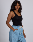 Side view of The Tank Top in Basic Black on Kandia
