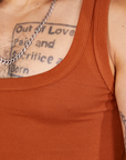 Front close up of Cropped Tank Top in Burnt Terracotta worn by Jesse
