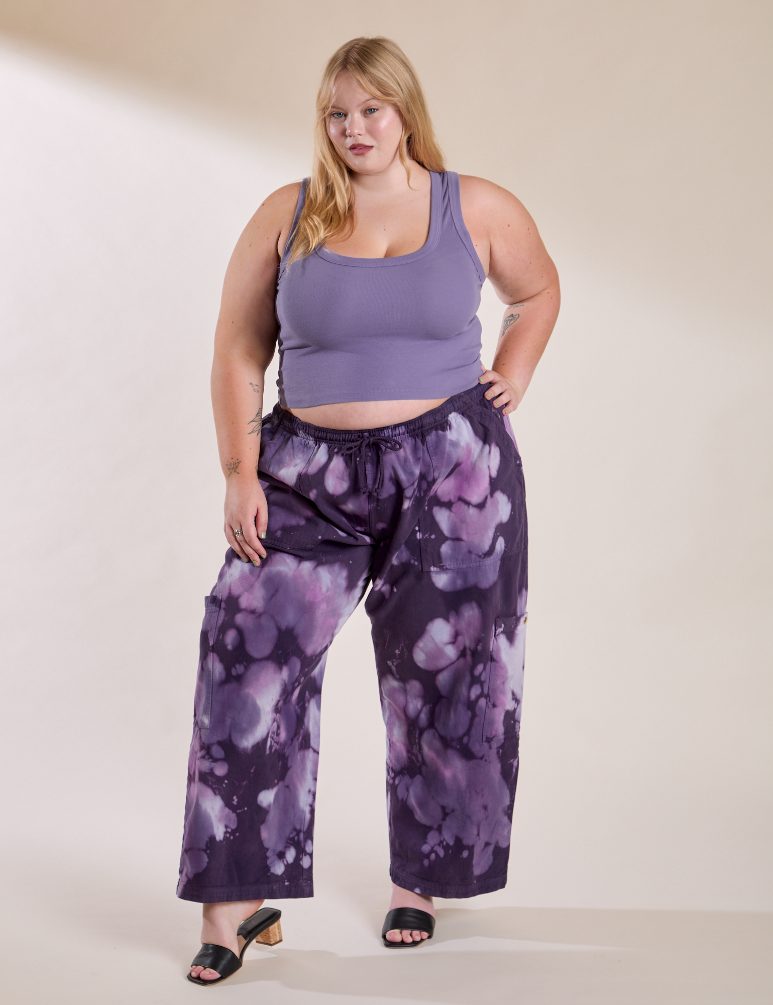 Juliet is wearing Magic Waters Drop Pocket Pants in Dark Lavender and Cropped Tank in Faded Grape