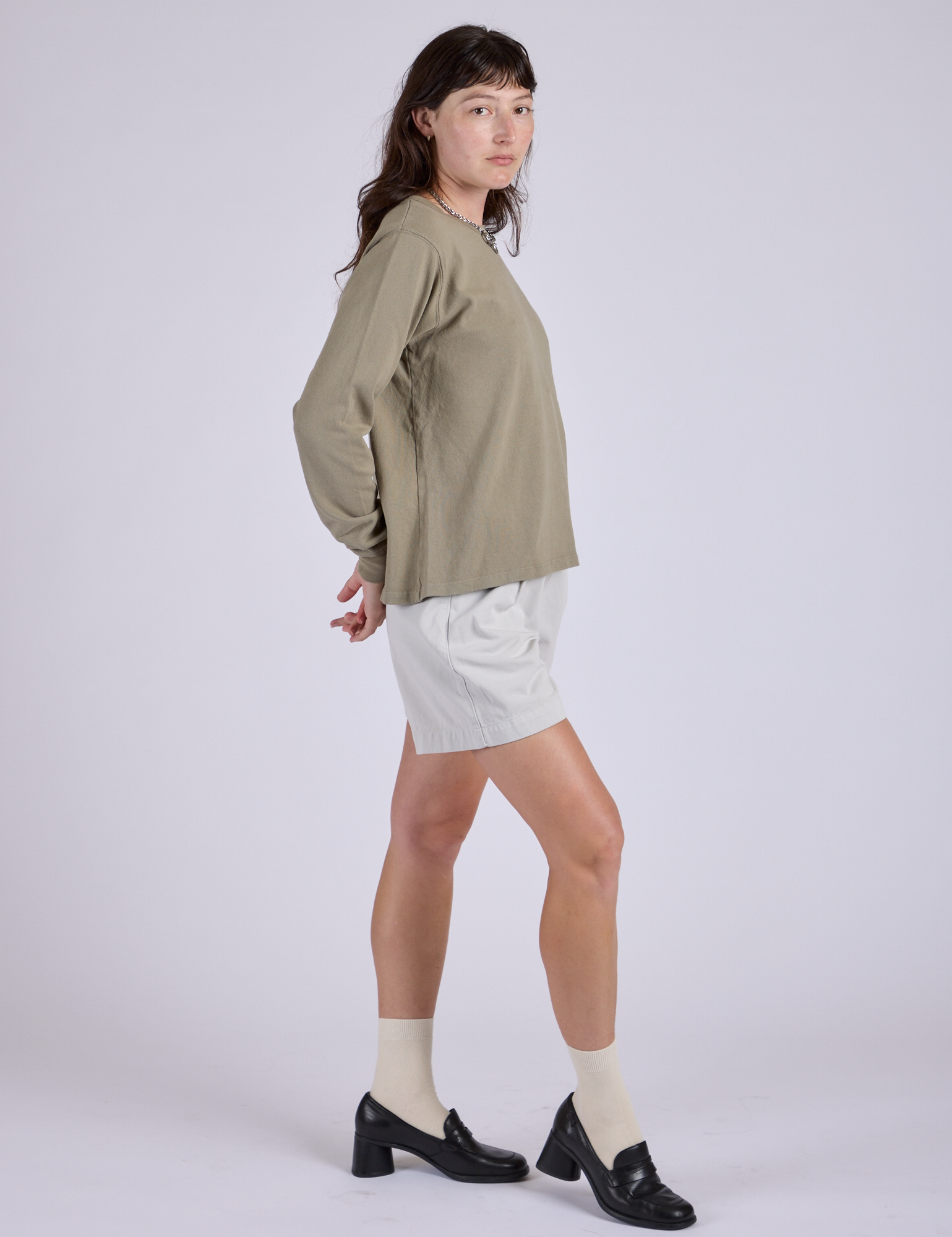 Side view of Pleated Trouser Shorts in Dishwater White and khaki grey Long Sleeve Burly Tee