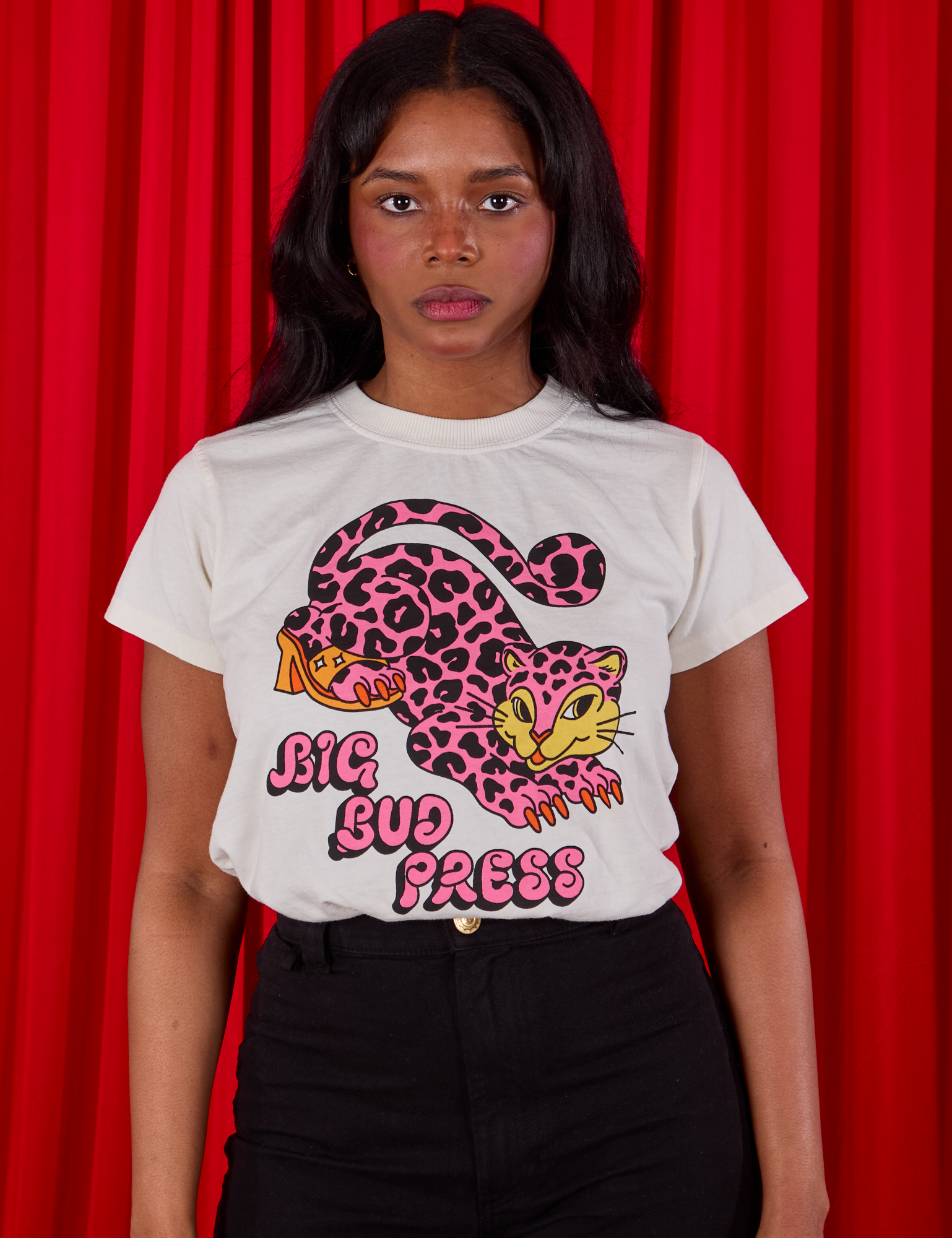 Kandia is wearing a tucked in Cheetah Organic Tee