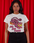 Kandia is wearing a tucked in Cheetah Organic Tee