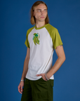 Angled front view of Produce Raglan Tee in Snap Peas on Grant