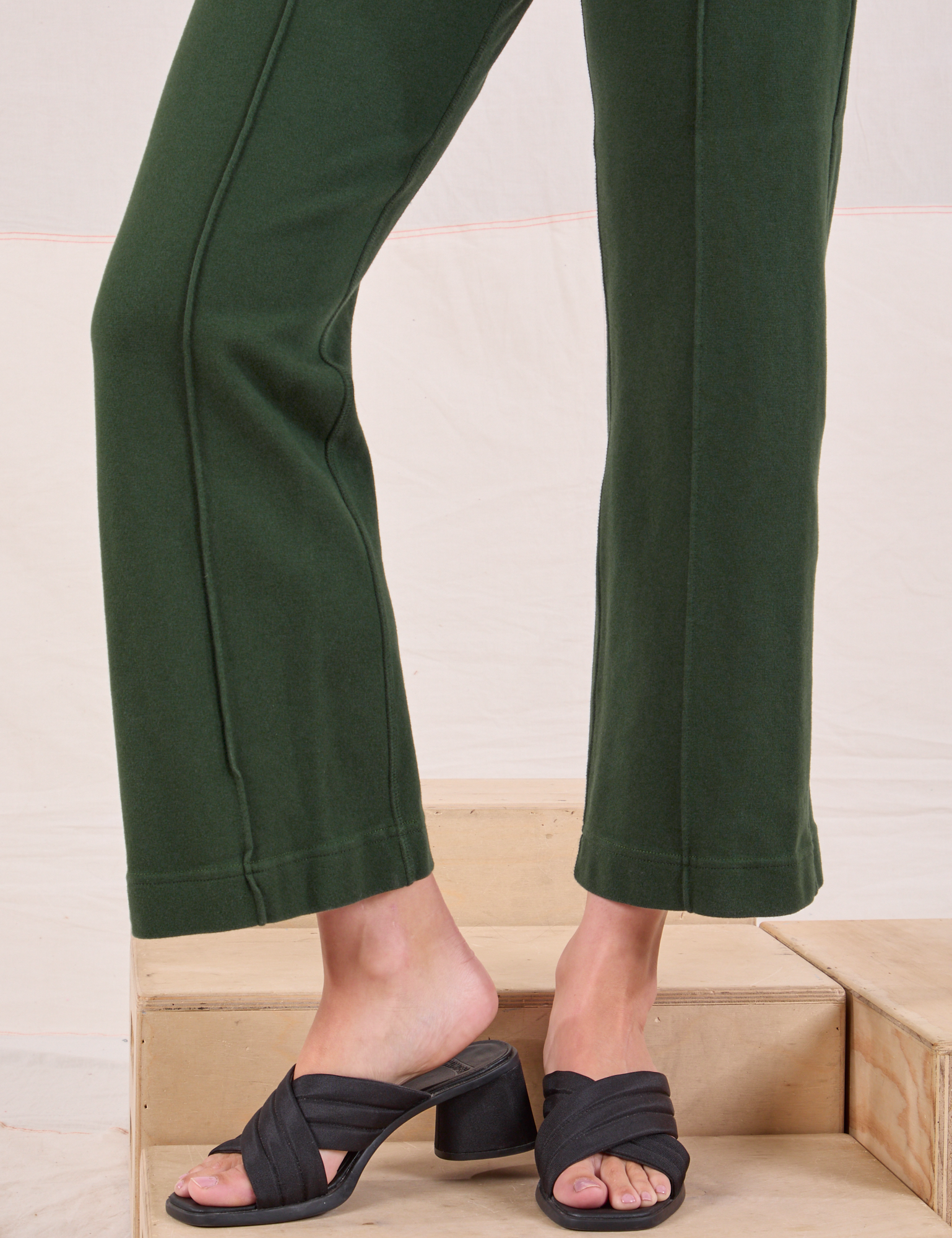 Easy Western Pants in Swamp Green pant leg close up on Alex