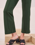 Easy Western Pants in Swamp Green pant leg close up on Alex