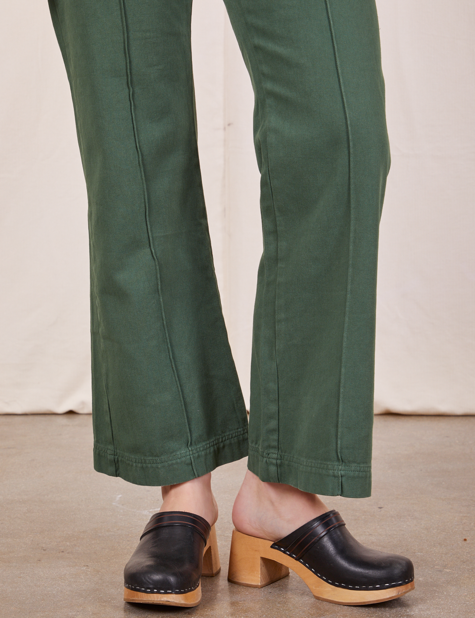 Pant leg close up of Western Pants in Dark Green Emerald worn by Alex