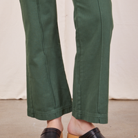 Pant leg close up of Western Pants in Dark Green Emerald worn by Alex