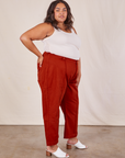 Side view of Western Pants in Paprika and vintage off-white Tank Top worn by Alicia