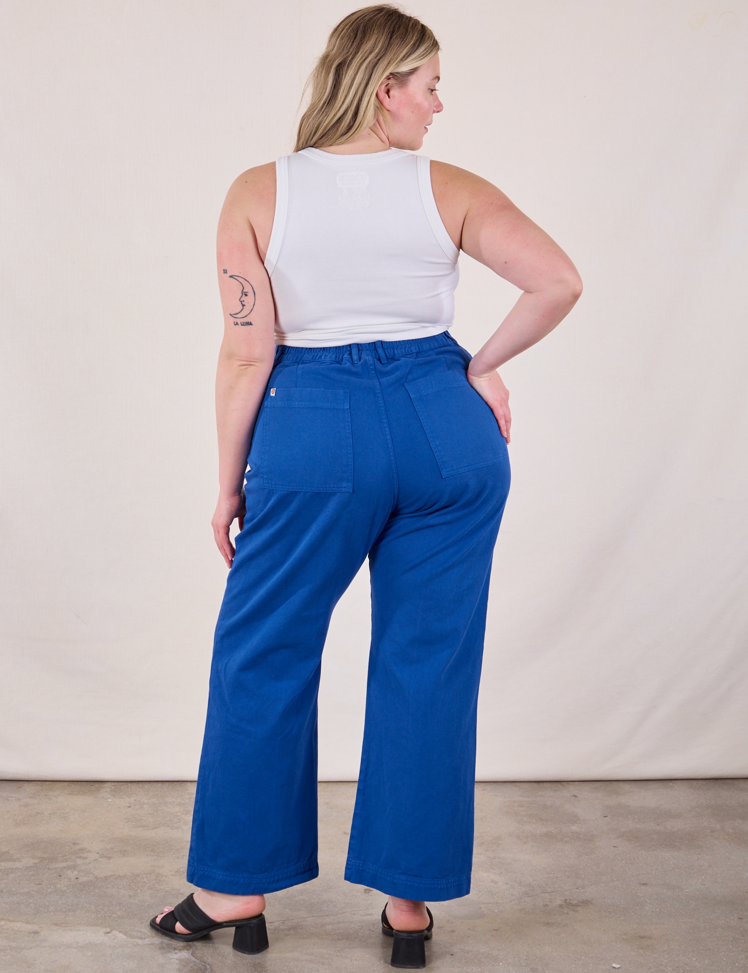 Back view of Western Pants in Royal Blue and Cropped Tank in Vintage Tee Off-White on Lish