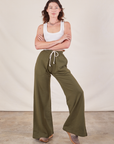 Alex is wearing Wide Leg Sweat Pants in Surplus Green and Cropped Tank in vintage tee off-white