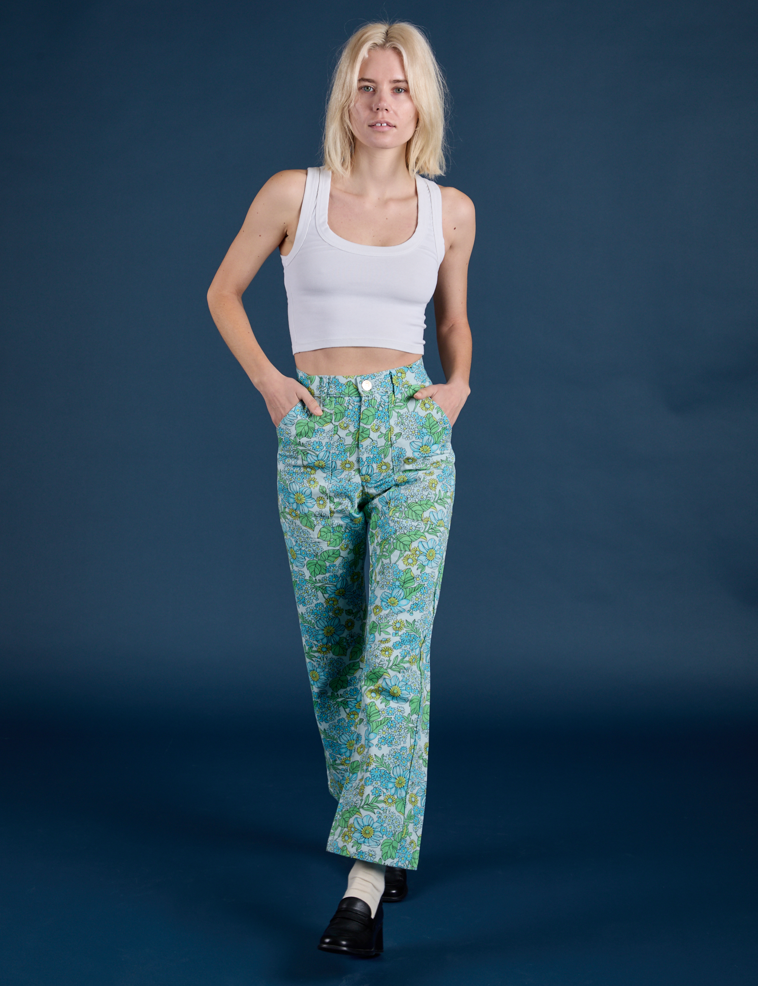 Madeline is wearing Winter Floral Print Work Pants and vintage tee white Cropped Tank 