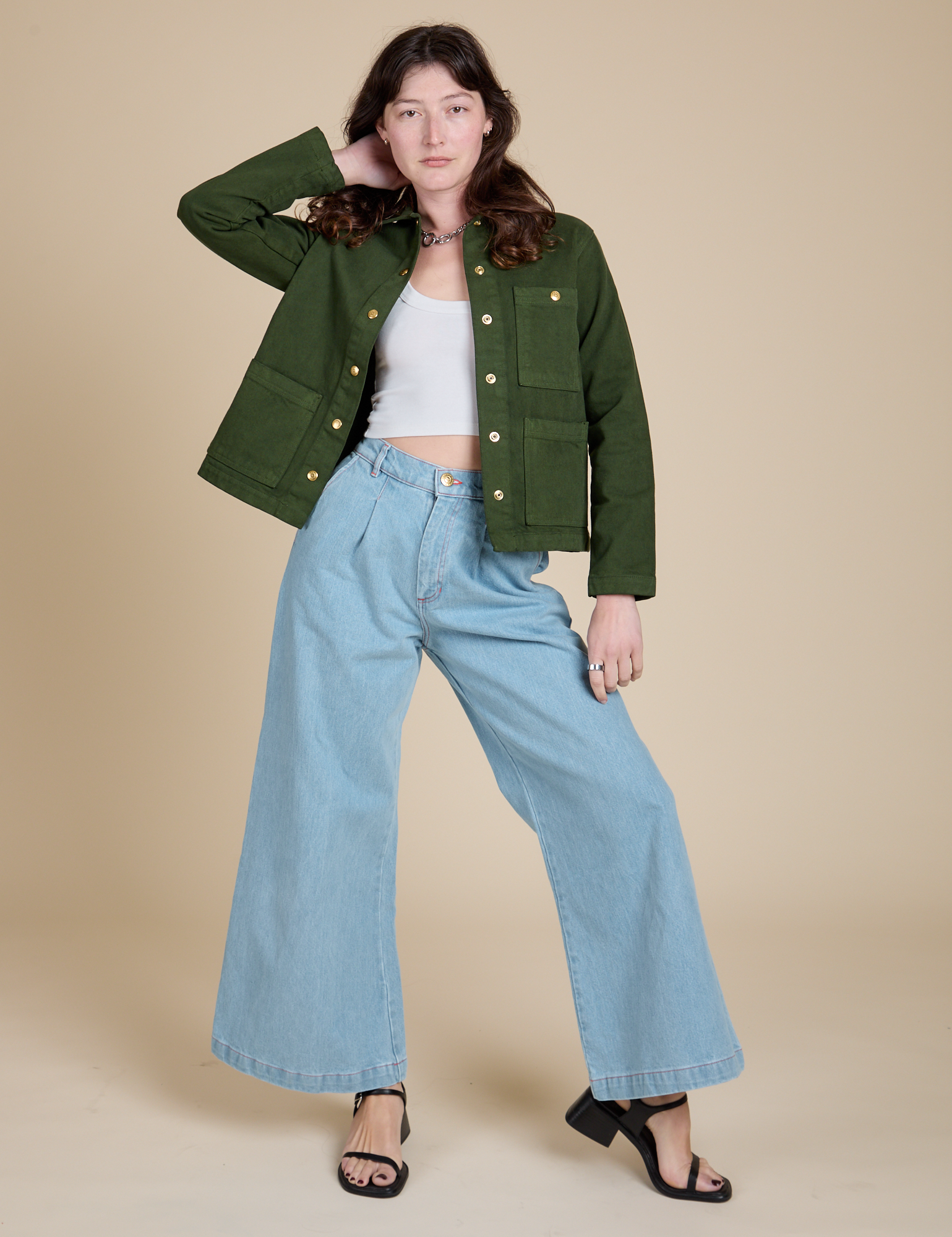 Alex is wearing Denim Work Jacket in Evergreen and light wash Indigo Wide Leg Trousers