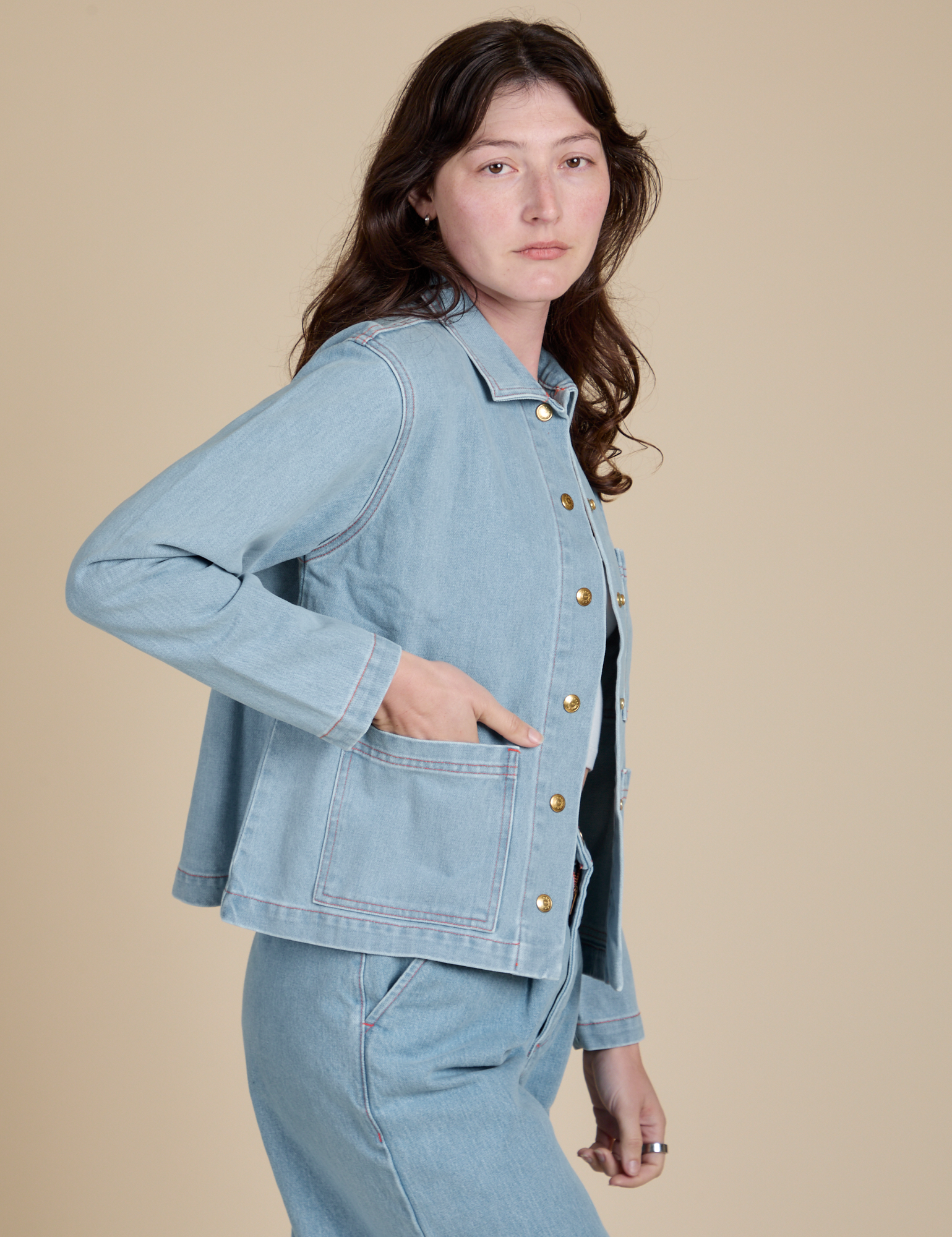 Side view of Indigo Denim Work Jacket in Light Wash on Alex