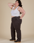 Side view of Work Pants in Espresso Brown and Cropped Tank in Vintage Tee White on Ashley