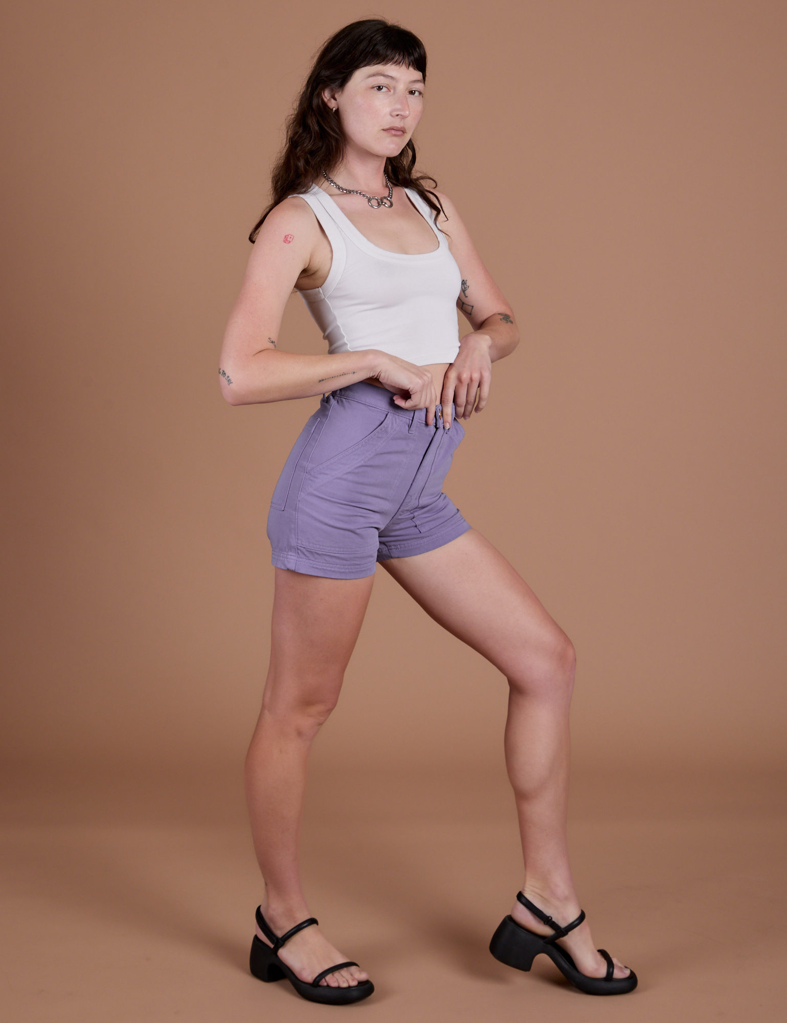Angled front view of Classic Work Shorts in Faded Grape and Cropped Tank in Vintage Tee White