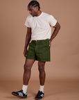 Angled front view of Classic Work Shorts in Evergreen and The Organic Vintage Tee in Vintage Off-White