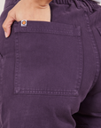 Classic Work Shorts in Nebula Purple back pocket close up. Tiara has her hand in the pocket.