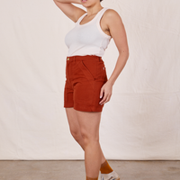 Side view of Classic Work Shorts in Paprika and vintage off-white Tank Top worn by Tiara