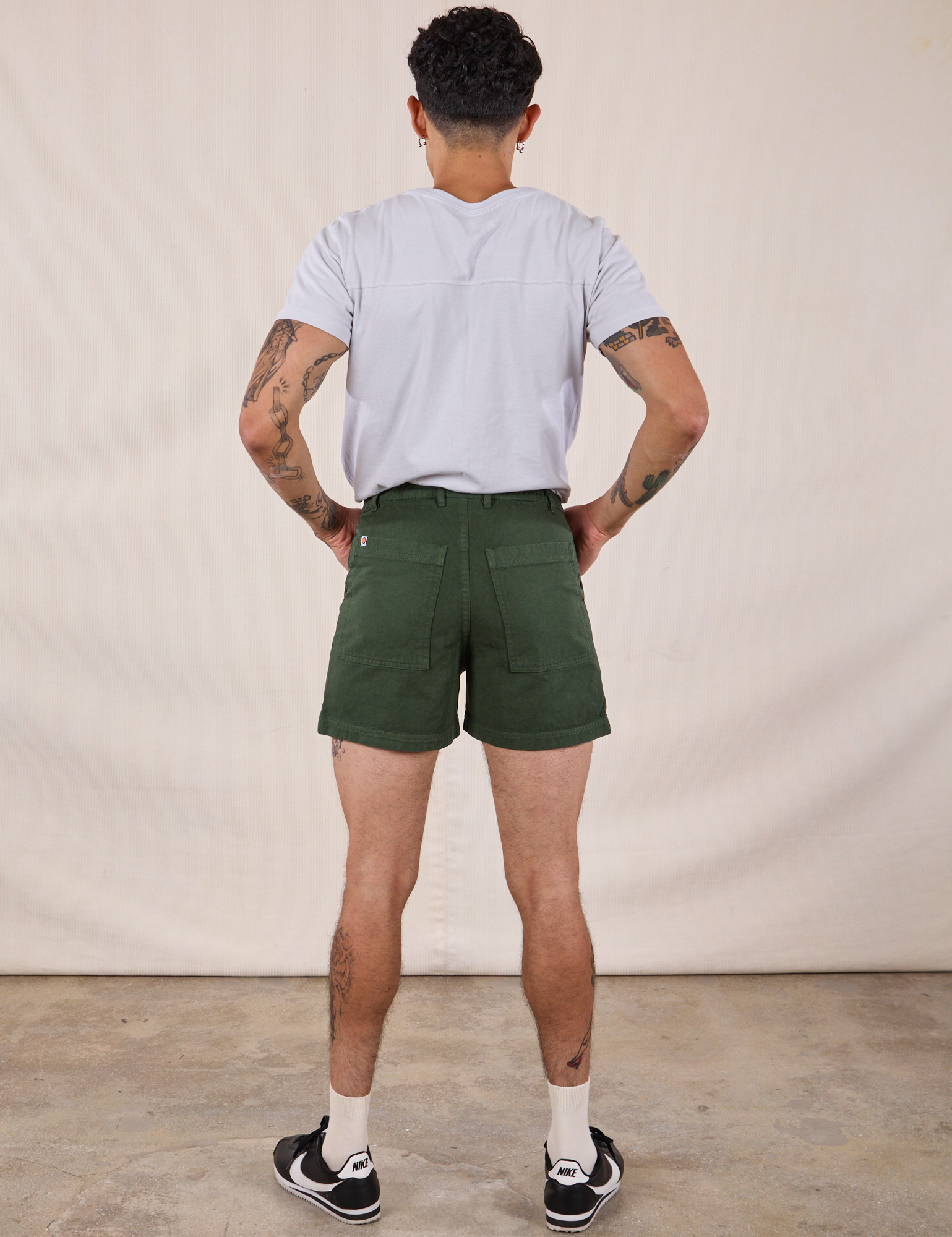 Back view of Classic Work Shorts in Swamp Green and Jr. Varsity Tee in Stone White on Jesse