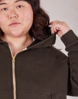 Cropped Zip Hoodie in Espresso Brown front close up. Ashley is holding the hood