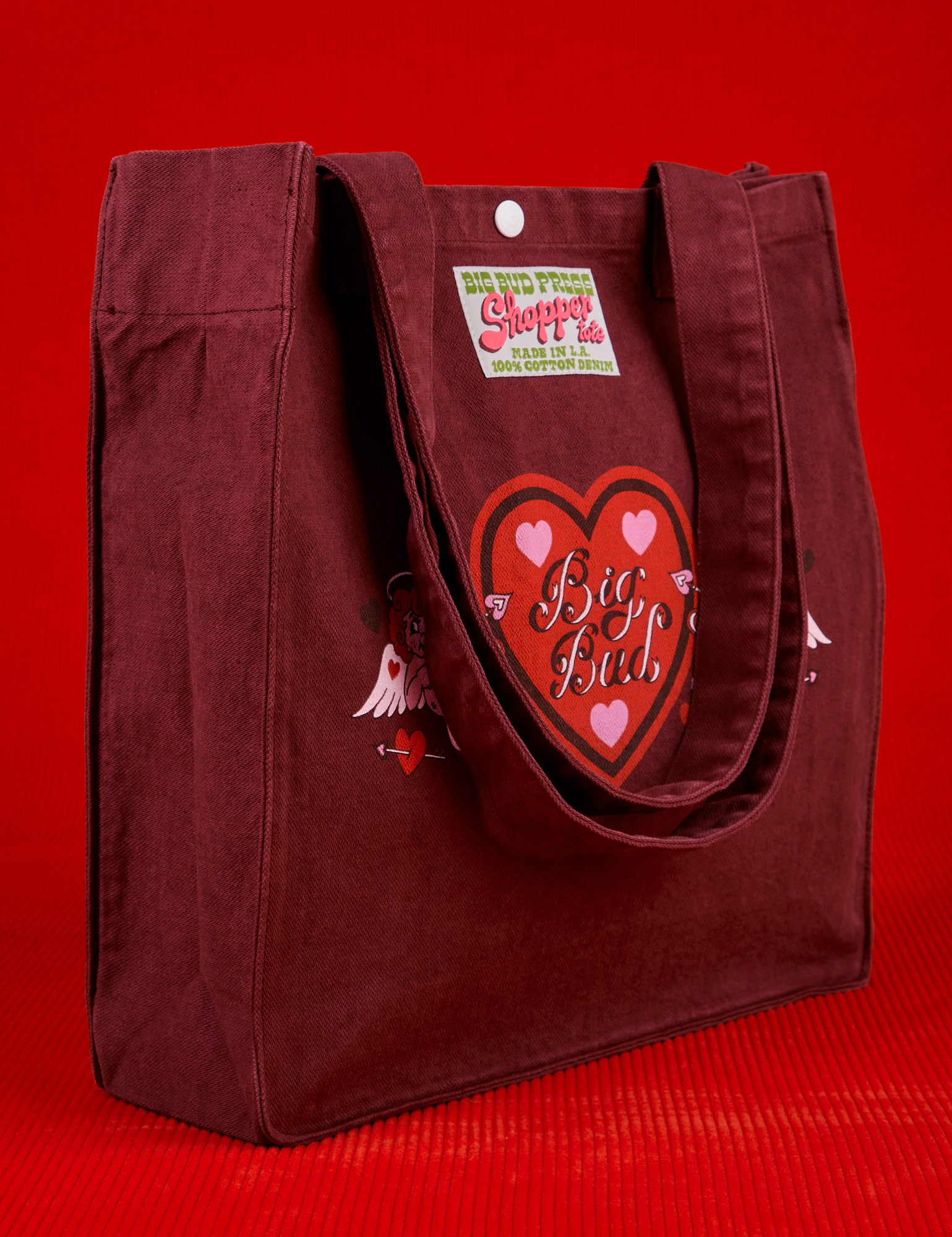 Angled front view of Love Big Bud Shopper Tote