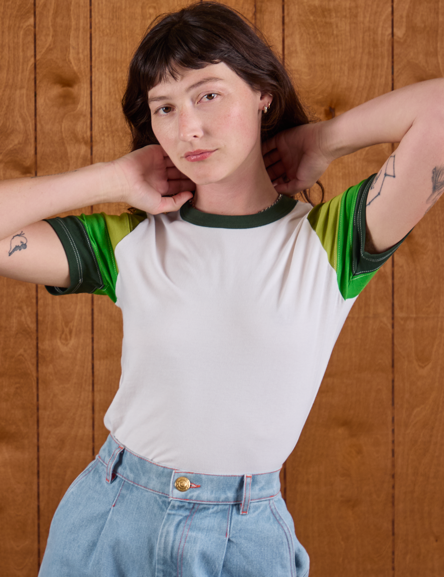 Alex is wearing Calypso Tee in Forest