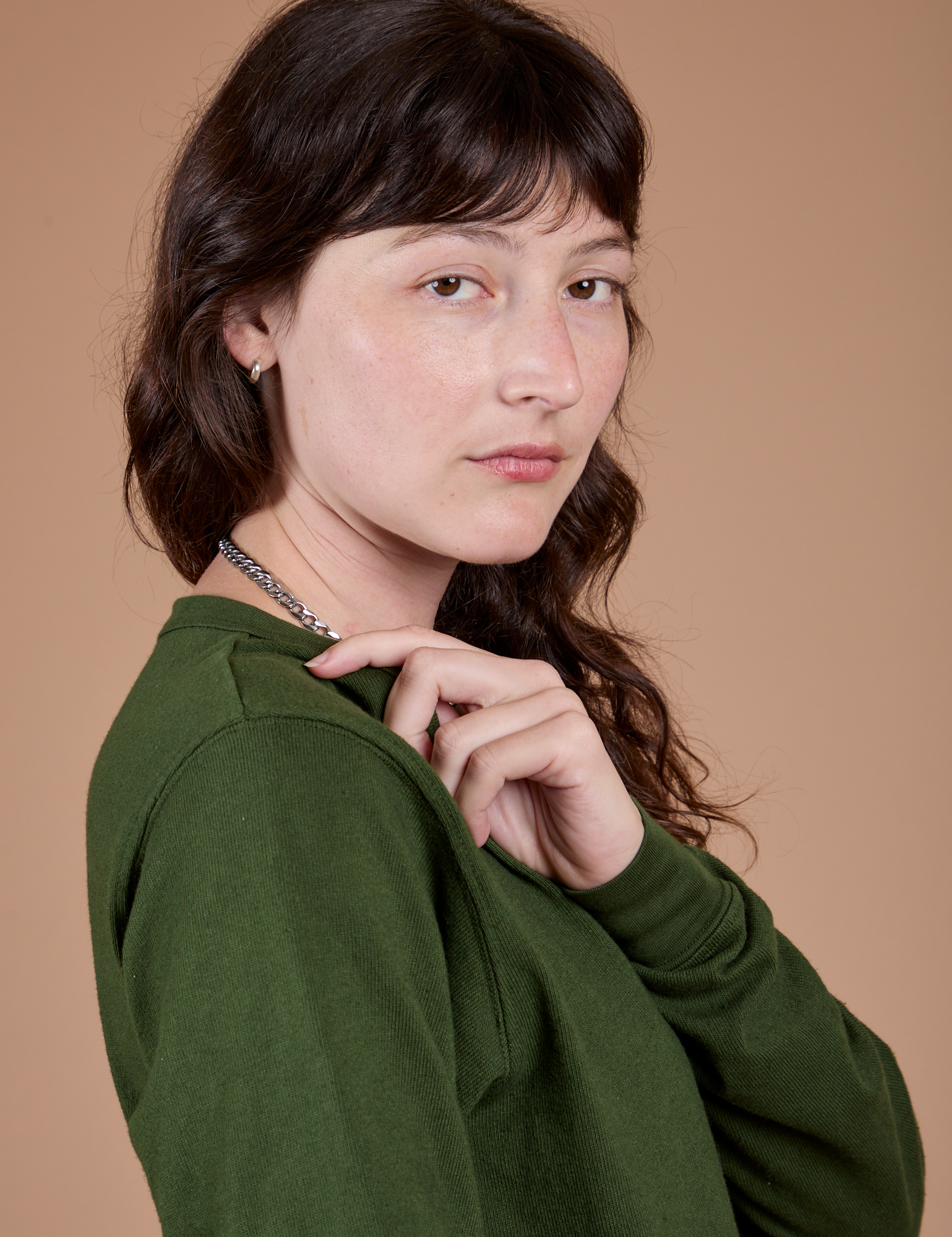 Long Sleeve Burly Tee in Evergreen side shoudler close up on Alex