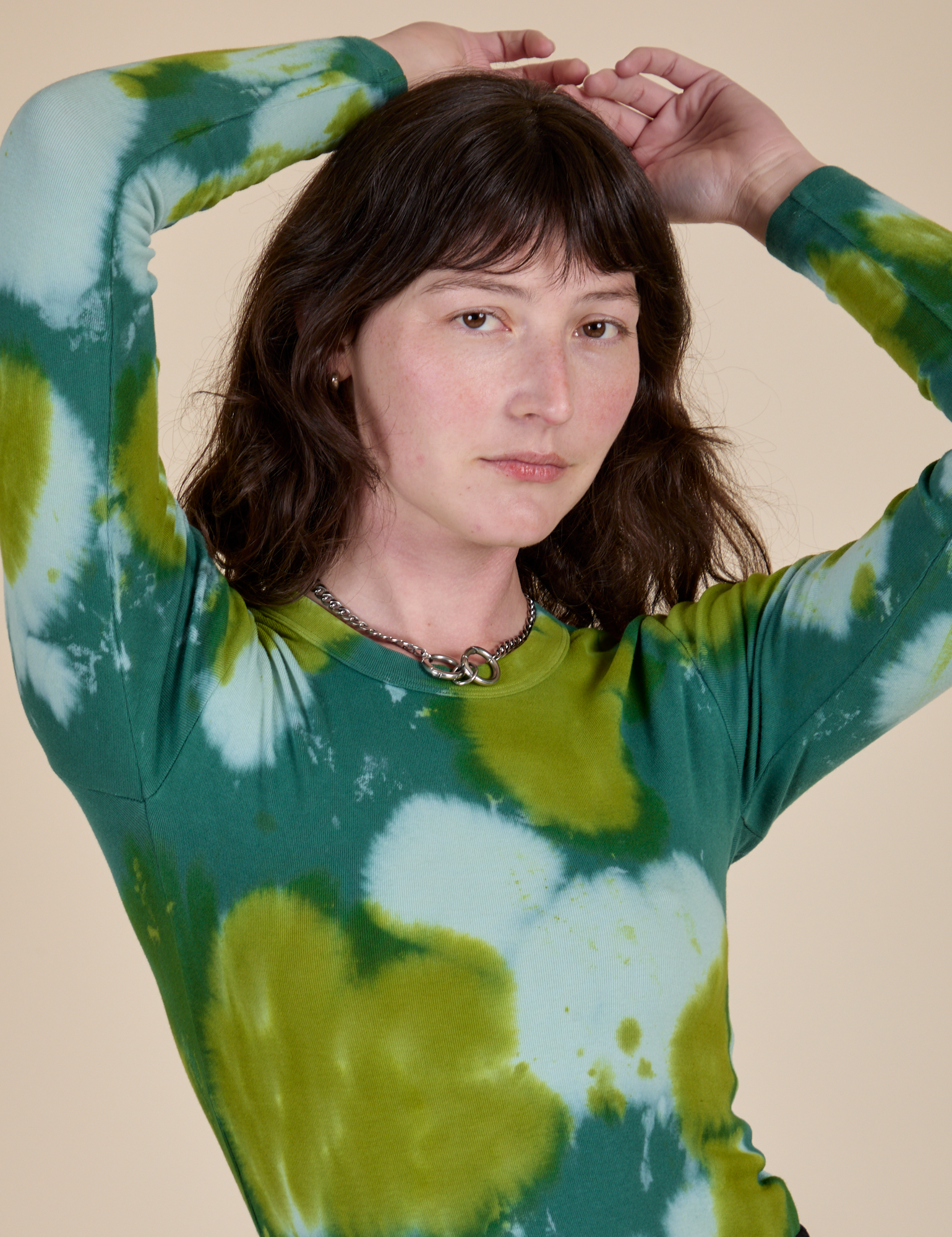 Long Sleeve Baby Tee in Green Magic Waters close up on Alex