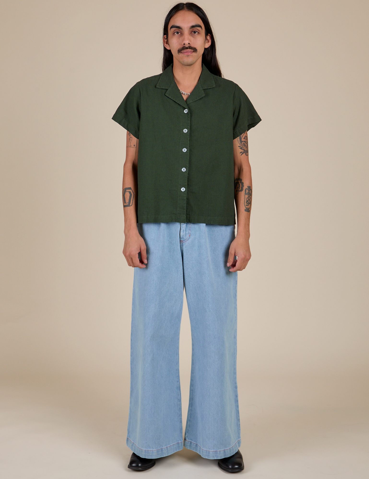 Pantry Button-Up in Swamp Green and light wash Indigo Wide Leg Trousers on Anthony