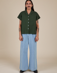 Pantry Button-Up in Swamp Green and light wash Indigo Wide Leg Trousers on Anthony