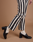 Black Stripe Work Pants in White pant leg close up on Alex