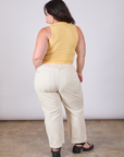 Back view of Tank Top in Butter Yellow and vintage tee off-white Work Pants on Ashley