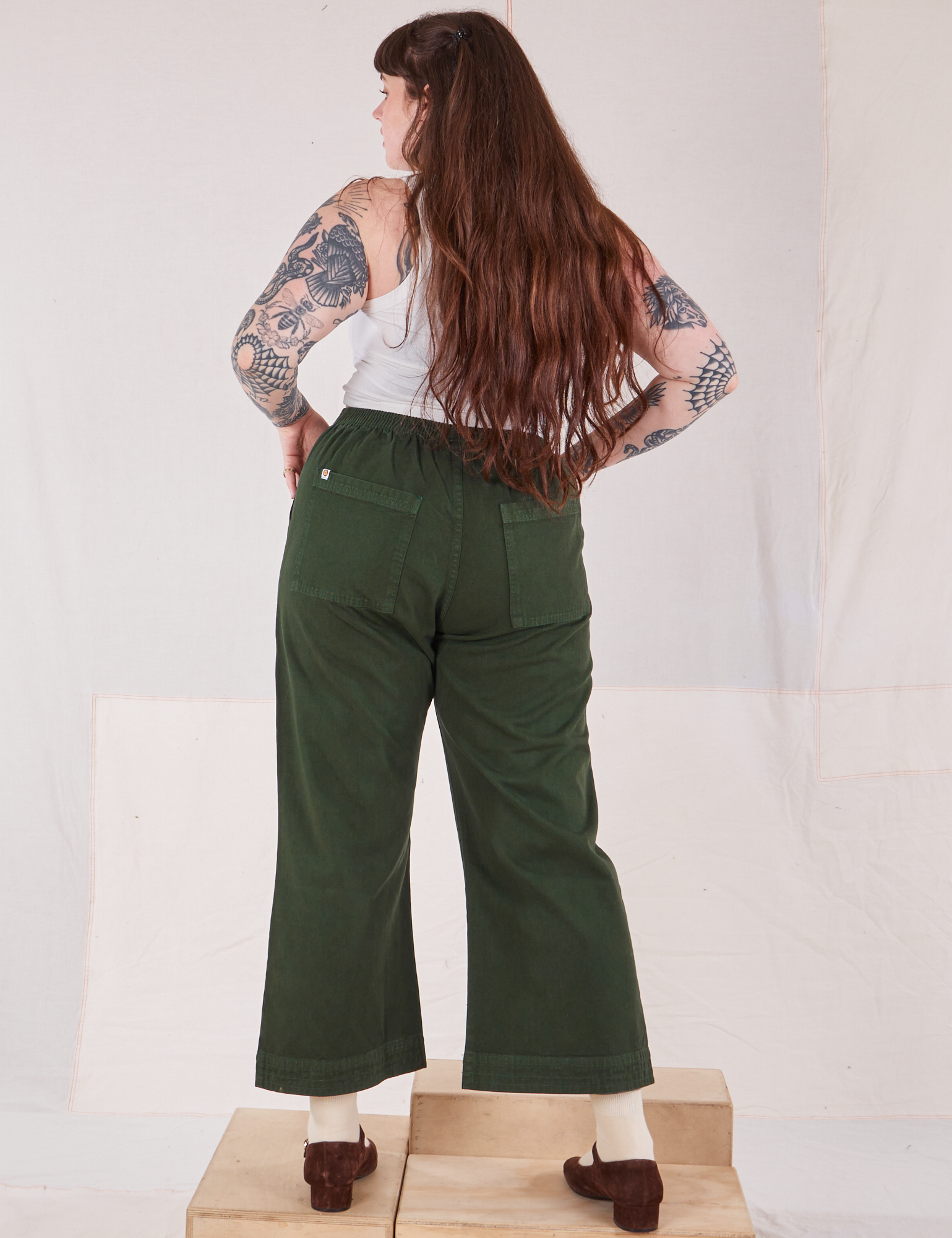 Action Pants in Swamp Green back view on Sydney