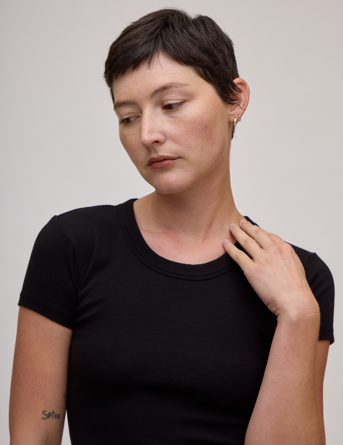 Front close up of Baby Tee in Basic Black on Alex