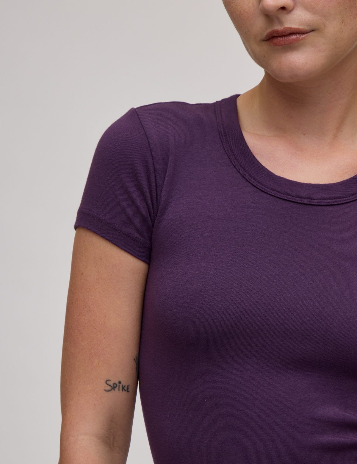 Front shoulder close up of Baby Tee in Nebula Purple on Alex