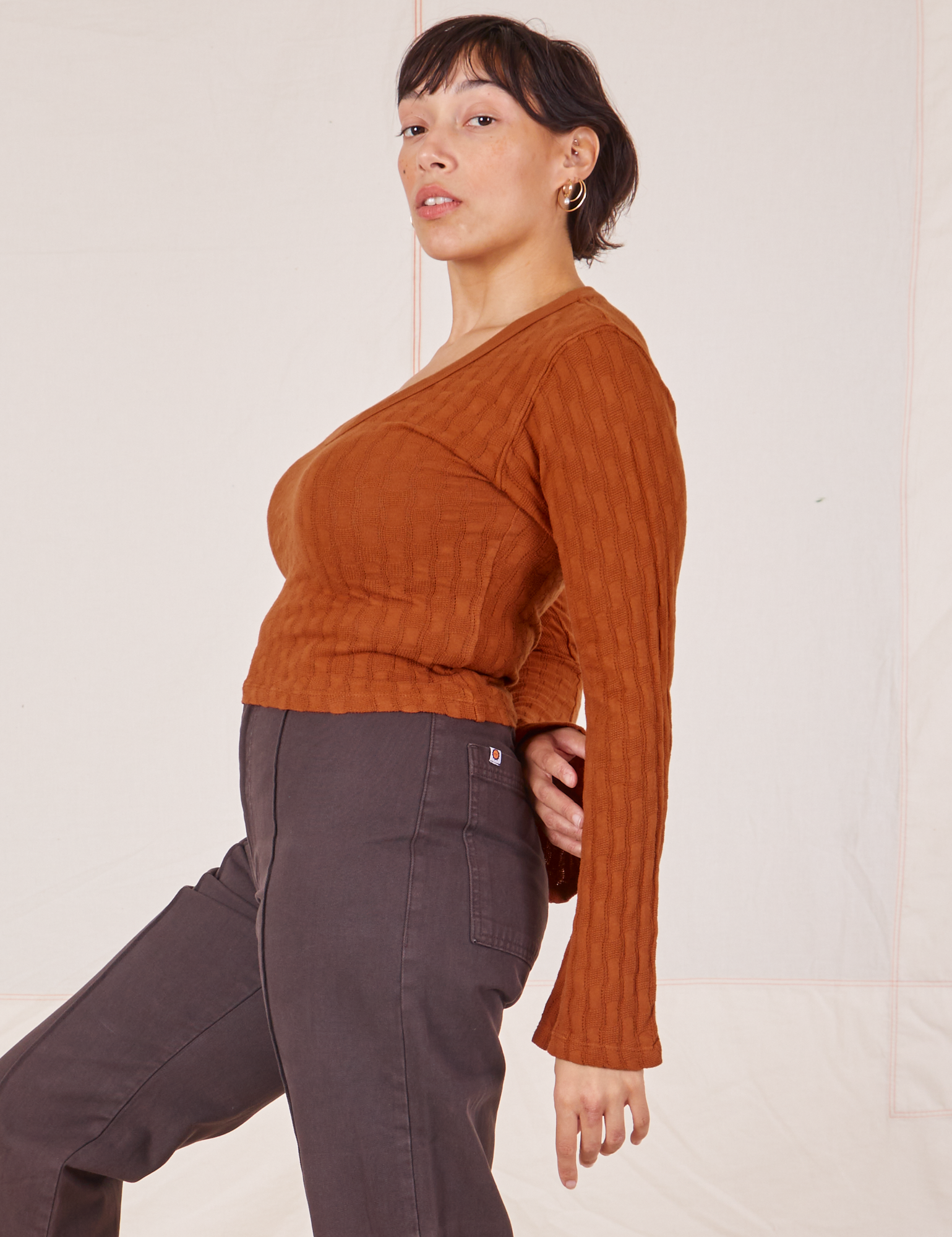 Side view of Bell Sleeve Top in Burnt Terracotta and espresso brown Western Pants