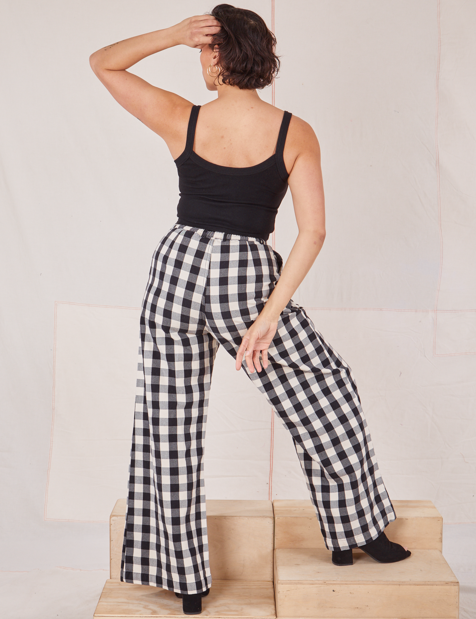 Back view of Wide Leg Trousers in Big Gingham and black Cropped Cami on Tiara