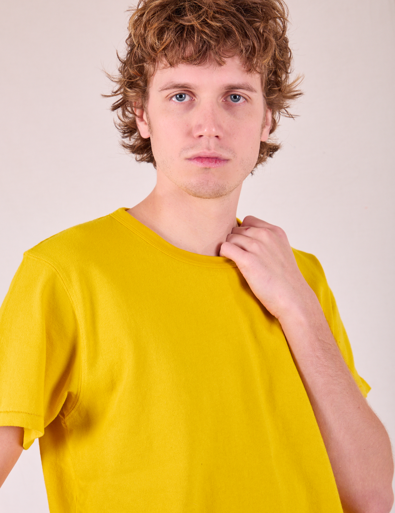 Burly Tee in Golden Yellow front close up on Quinn