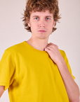 Burly Tee in Golden Yellow front close up on Quinn