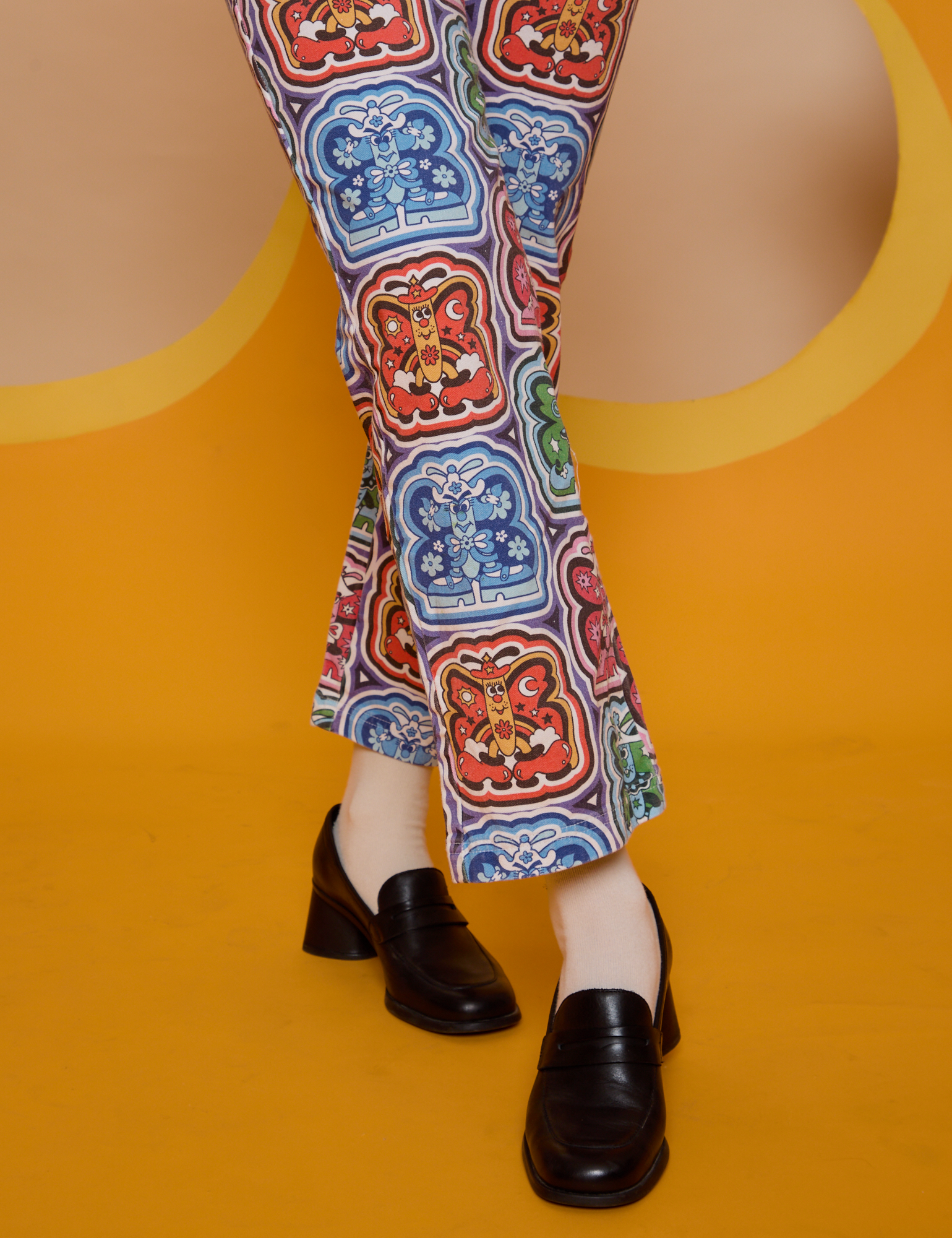 Butterfly Kaleidoscope Work Pants pant leg close up on Alex