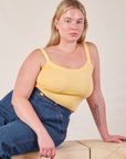 Lish is wearing Cropped Cami in Butter Yellow and dark wash Carpenter Jeans