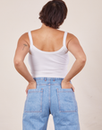 Back view of Cropped Cami in Vintage Off-White and light wash Sailor Jeans worn by Tiara